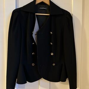 Louis Feraud waist length jacket with ruffle bottom over top of hips.